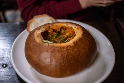 Ciorbă soup served in a bread bowl — Central Europe