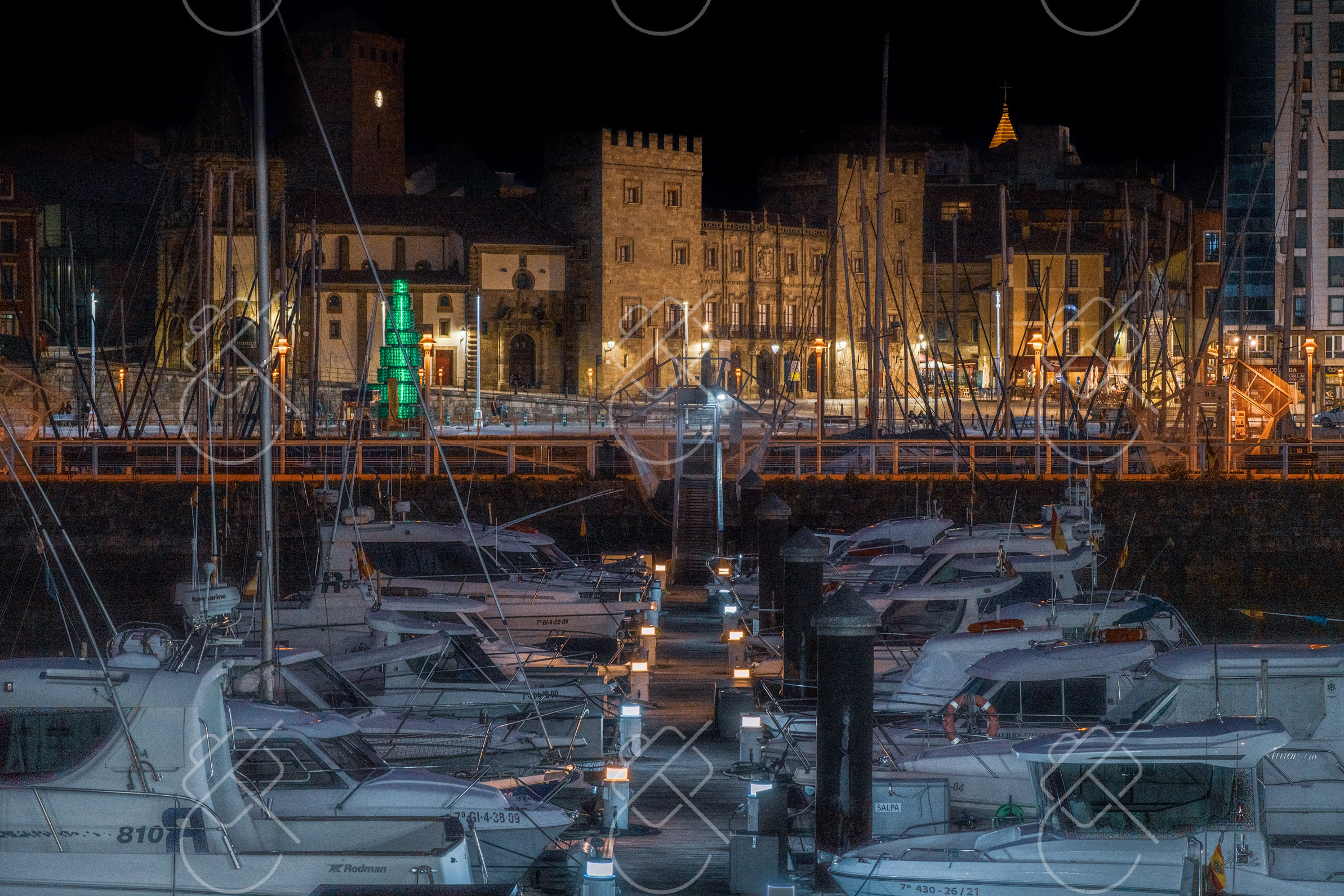 Cimadevilla's lit facades reflected in the marina at night — Gijón, fine art travel photography print available from Clever Tourists