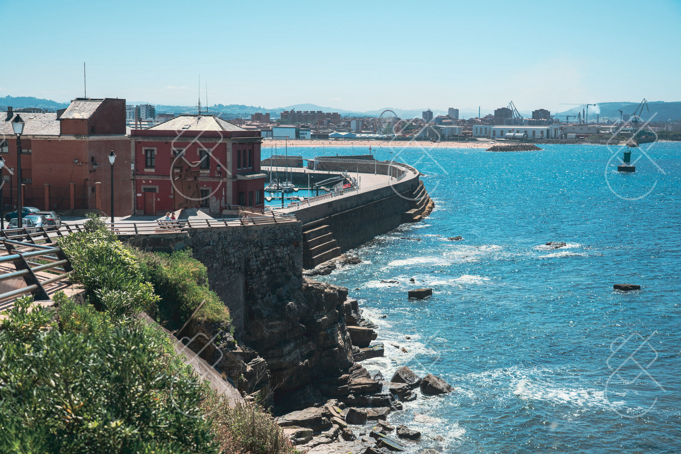 The rocky coastline below Cerro de Santa Catalina, with the port beyond — Gijón, fine art travel photography print available from Clever Tourists