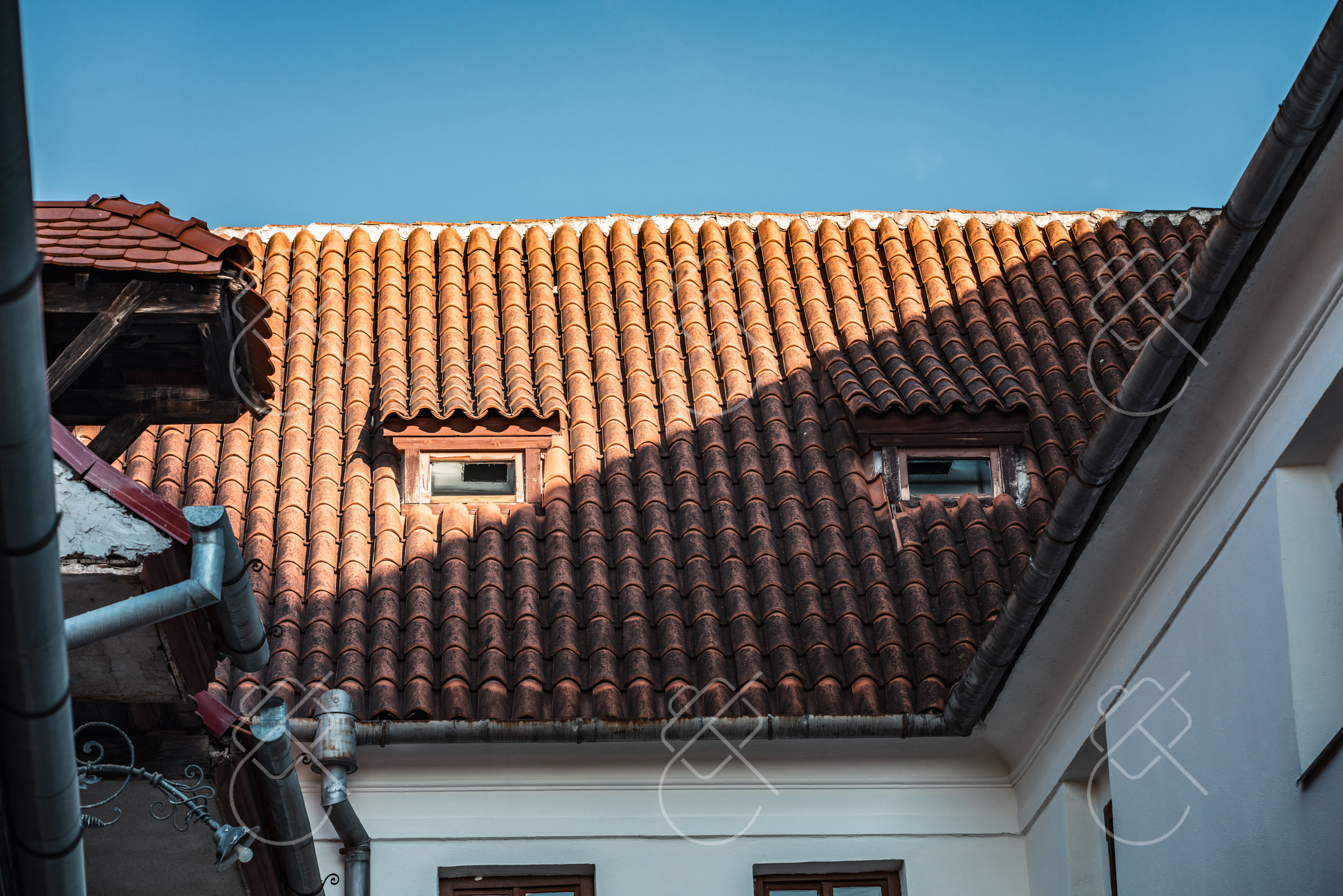 The Evangelical Cathedral's Gothic spire rising against a bright Transylvanian sky — Sibiu, fine art travel photography print available from Clever Tourists