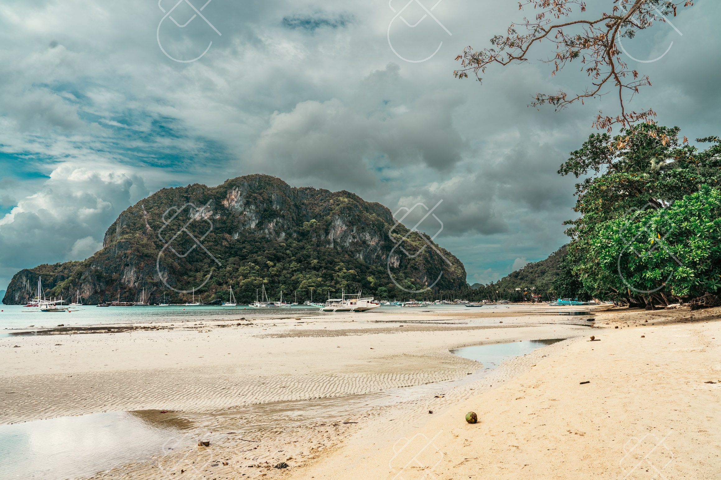 A narrow El Nido town alley with tricycles and green hills behind — El Nido, fine art travel photography print available from Clever Tourists
