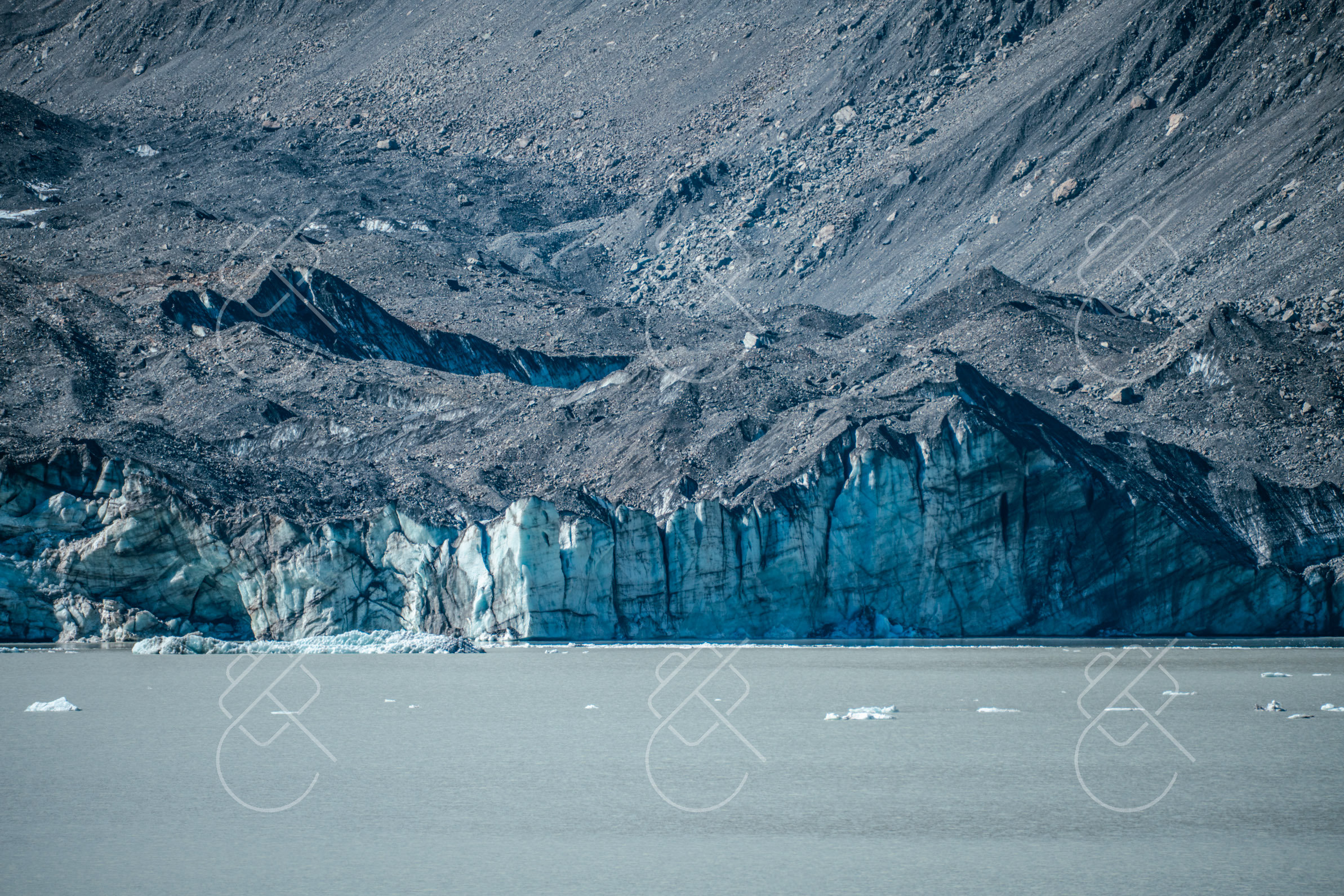 Terminal ice wall and blue glacier seracs calving into the lake water — Lake Pukaki, fine art travel photography print available from Clever Tourists