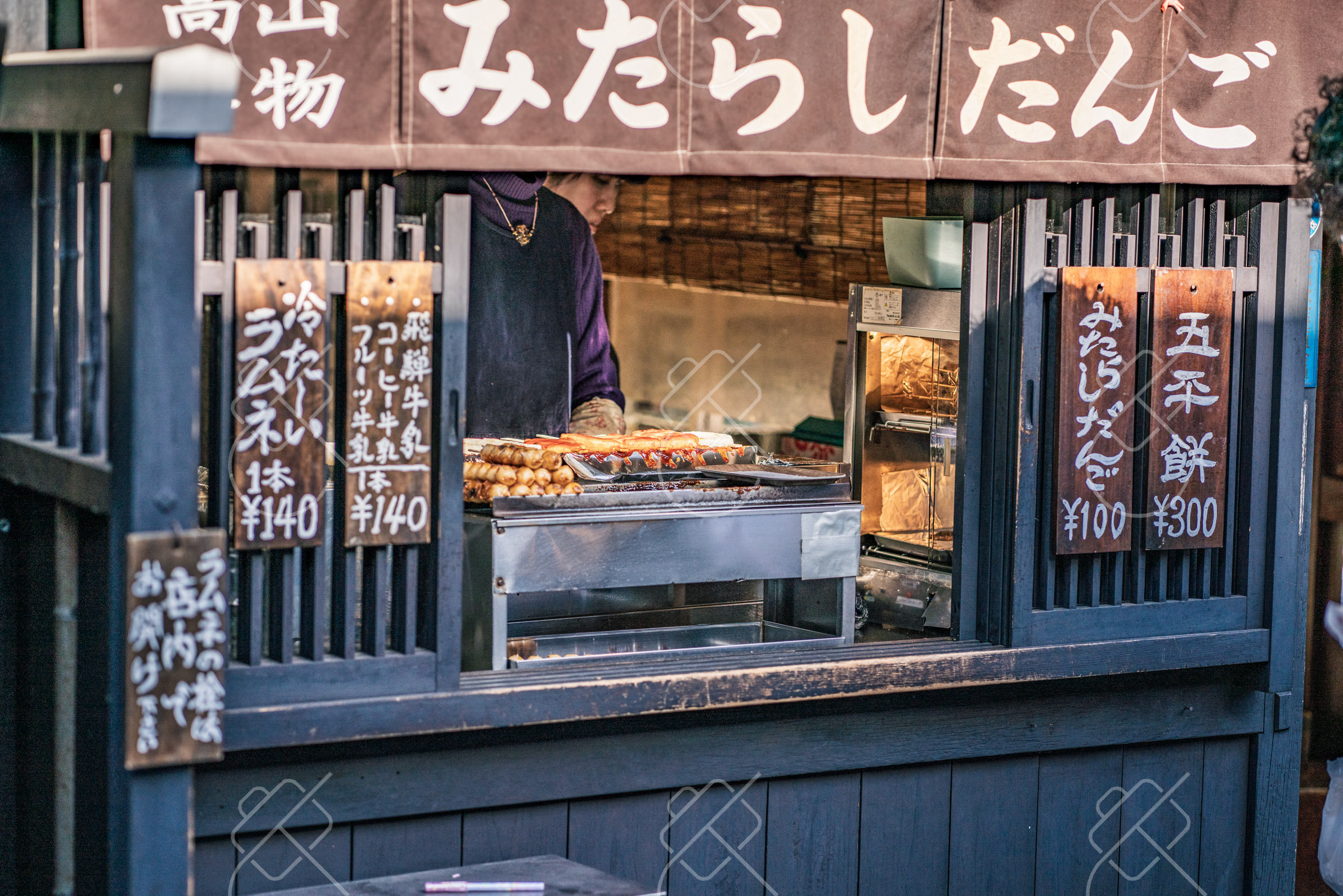 A street stall selling soy-glazed mitarashi dango and goheimochi rice cakes — Takayama, fine art travel photography print available from Clever Tourists
