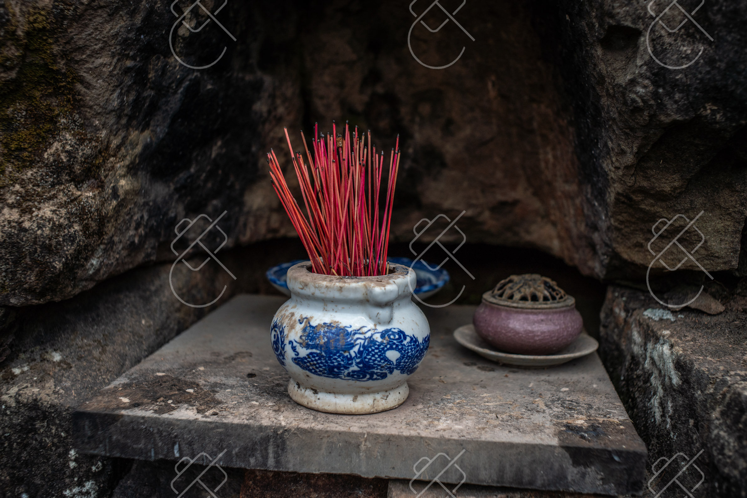 Incense and offerings set out at a shrine in the sanctuary — Quảng Nam