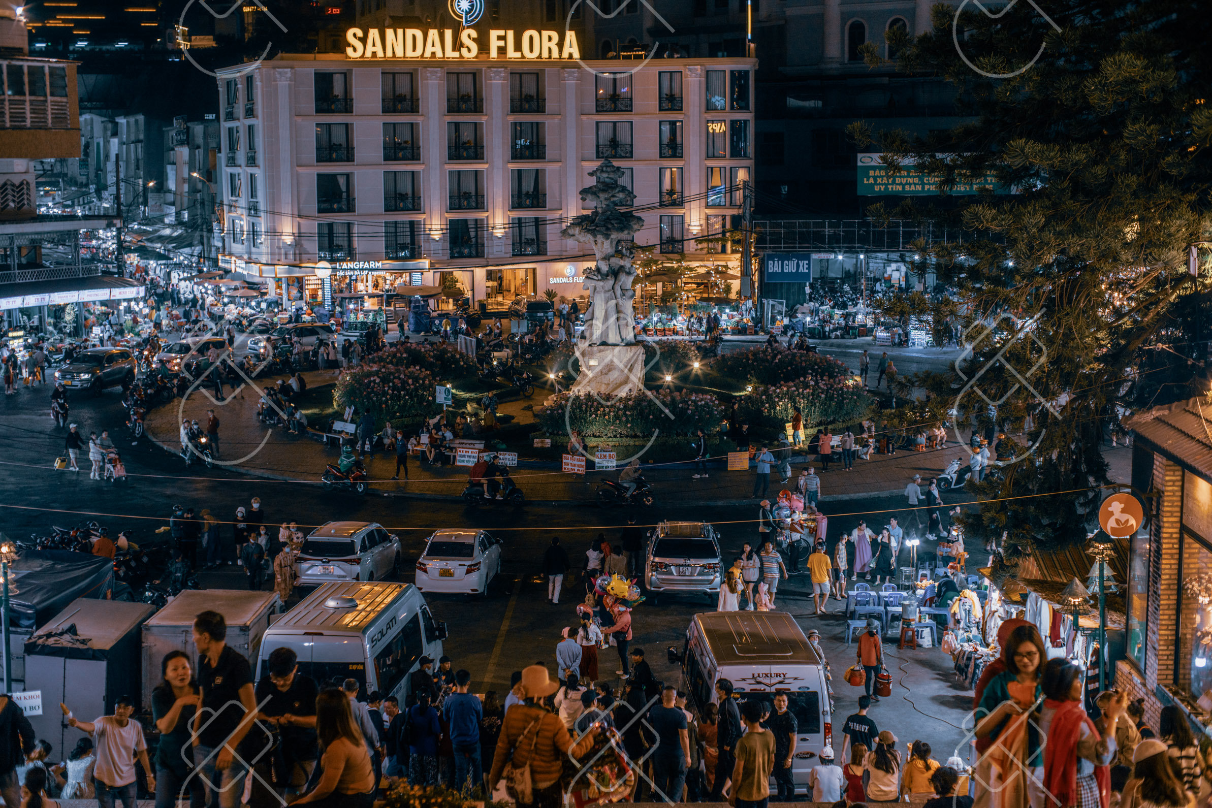 Evening crowds and traffic filling the roundabout in central Da Lat — Da Lat, fine art travel photography print available from Clever Tourists
