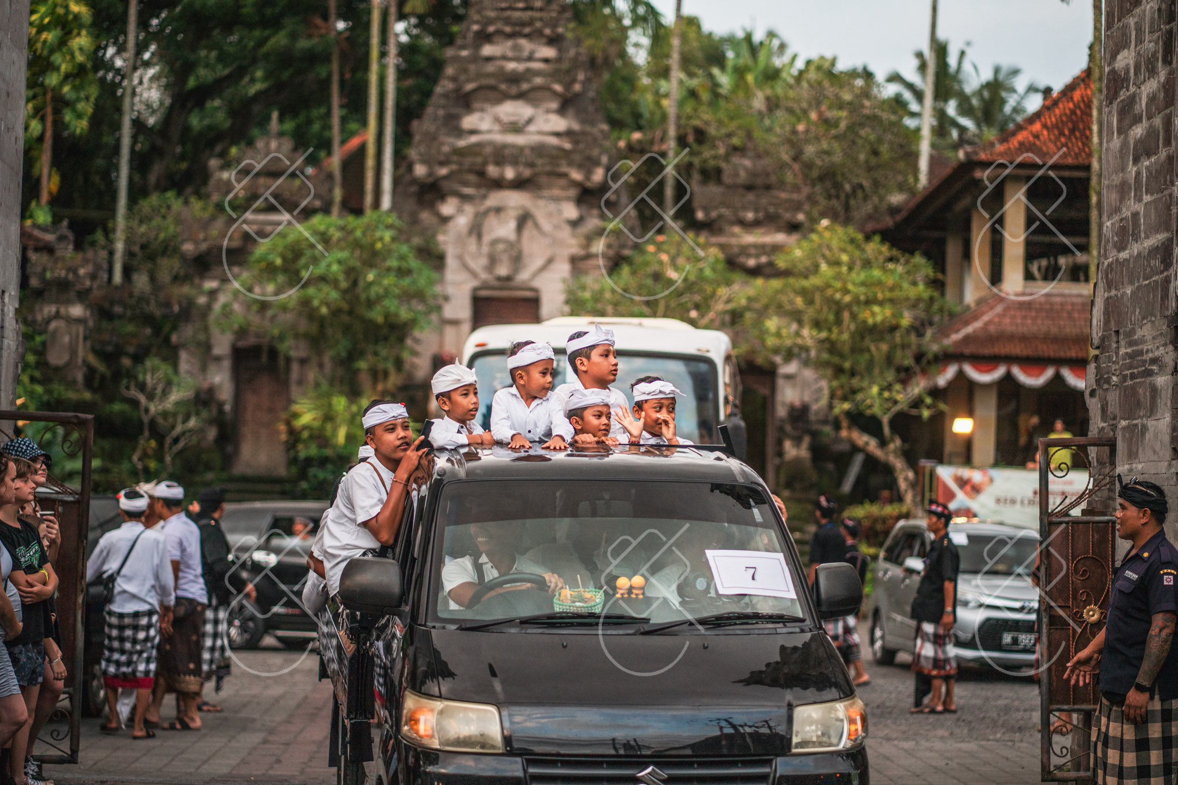 Children in ceremonial white and gold dress during a temple procession — Ubud, fine art travel photography print available from Clever Tourists
