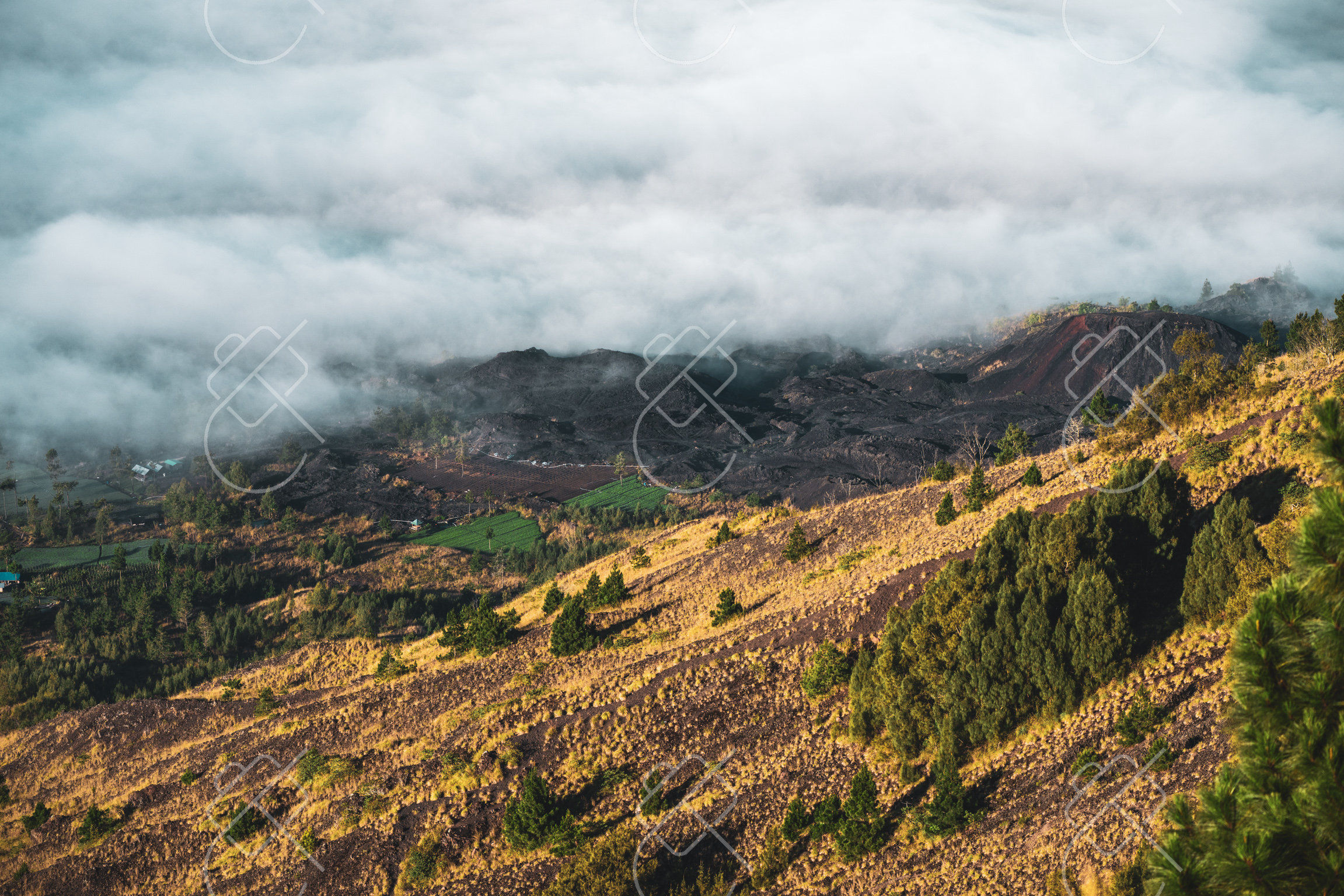 Vast black basalt lava fields stretching across the volcanic floor of the caldera — Kintamani, fine art travel photography print available from Clever Tourists