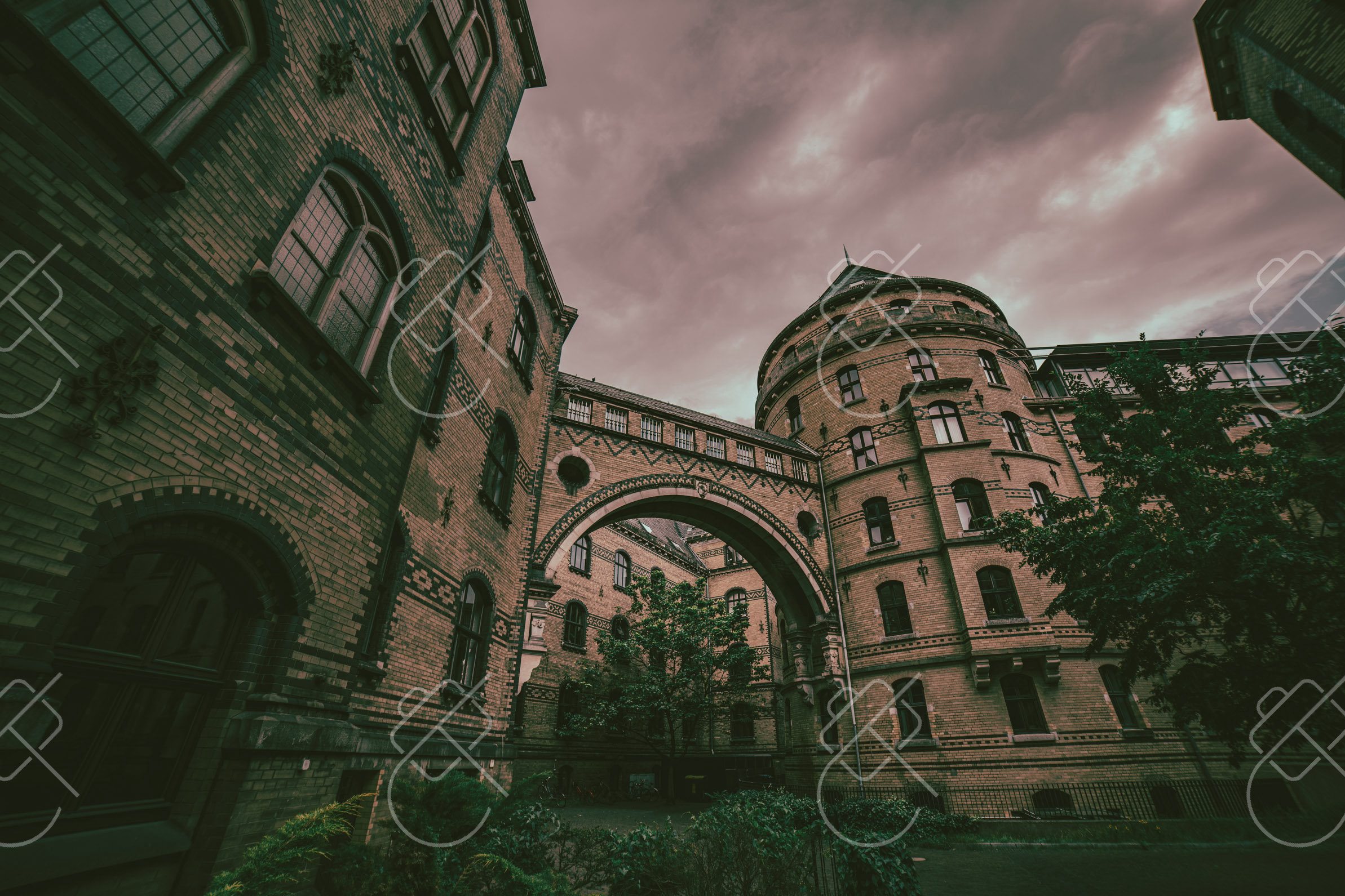 A brick archway passage leading toward one of Böttcherstraße's courtyards — Bremen, fine art travel photography print available from Clever Tourists