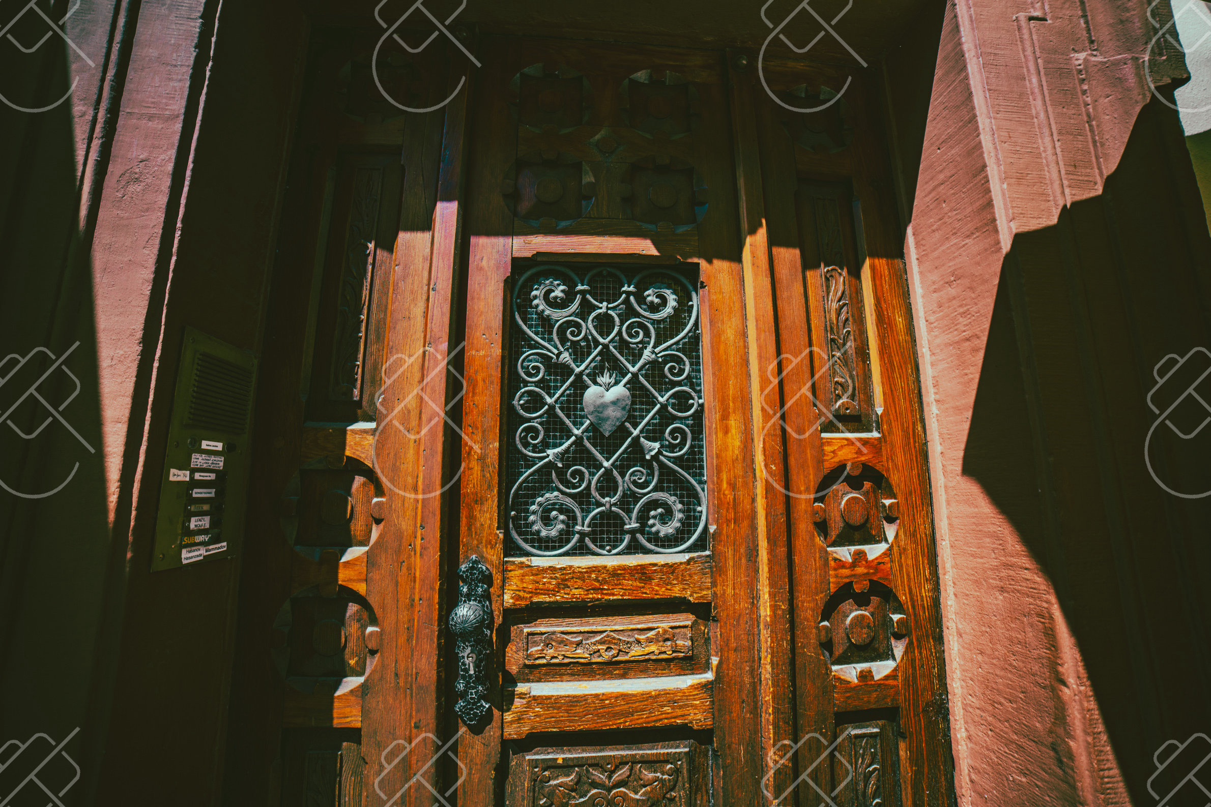 Wood Door and Iron Grille in Shadow, photographed in Germany
