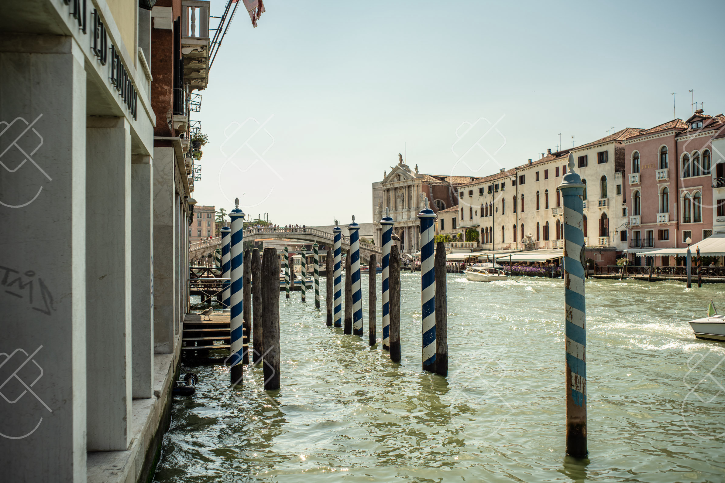 Terracotta tiled rooftops, stone church bell towers, and open lagoon waters — Venice, fine art travel photography print available from Clever Tourists
