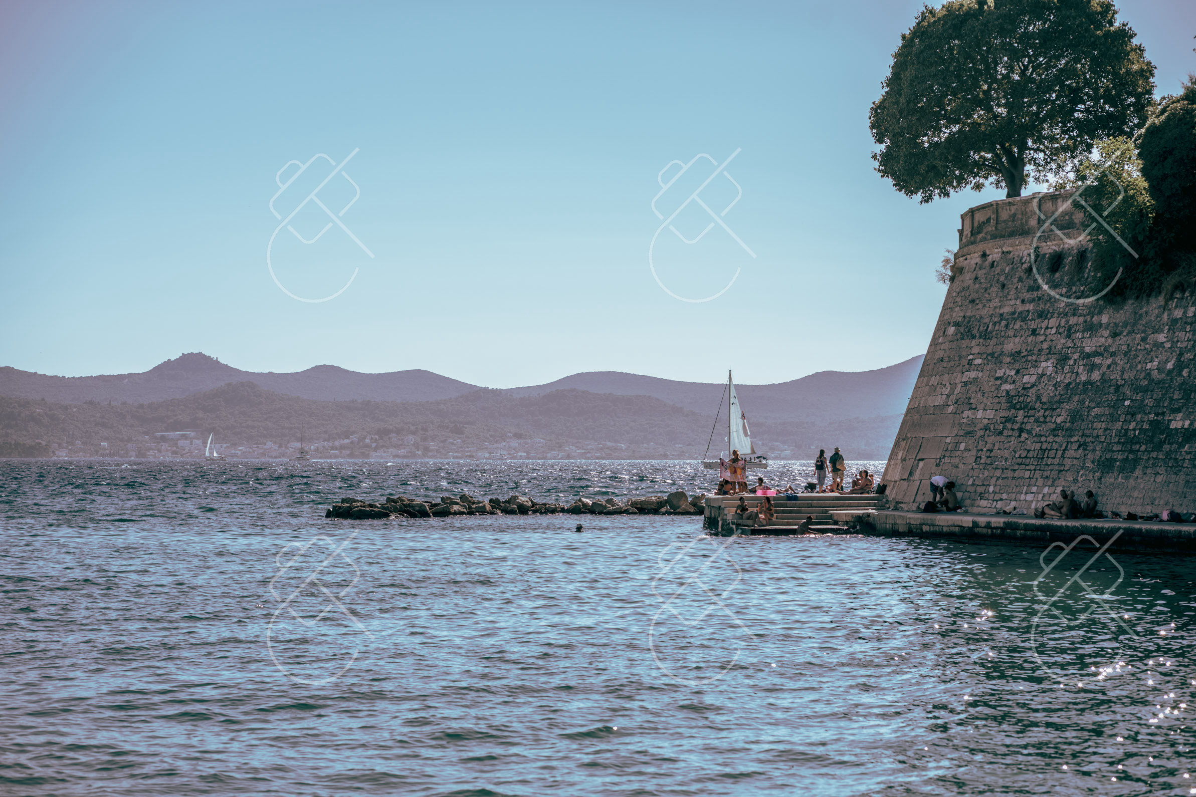 The city walls meeting the sea near the Sea Organ — Zadar, fine art travel photography print available from Clever Tourists
