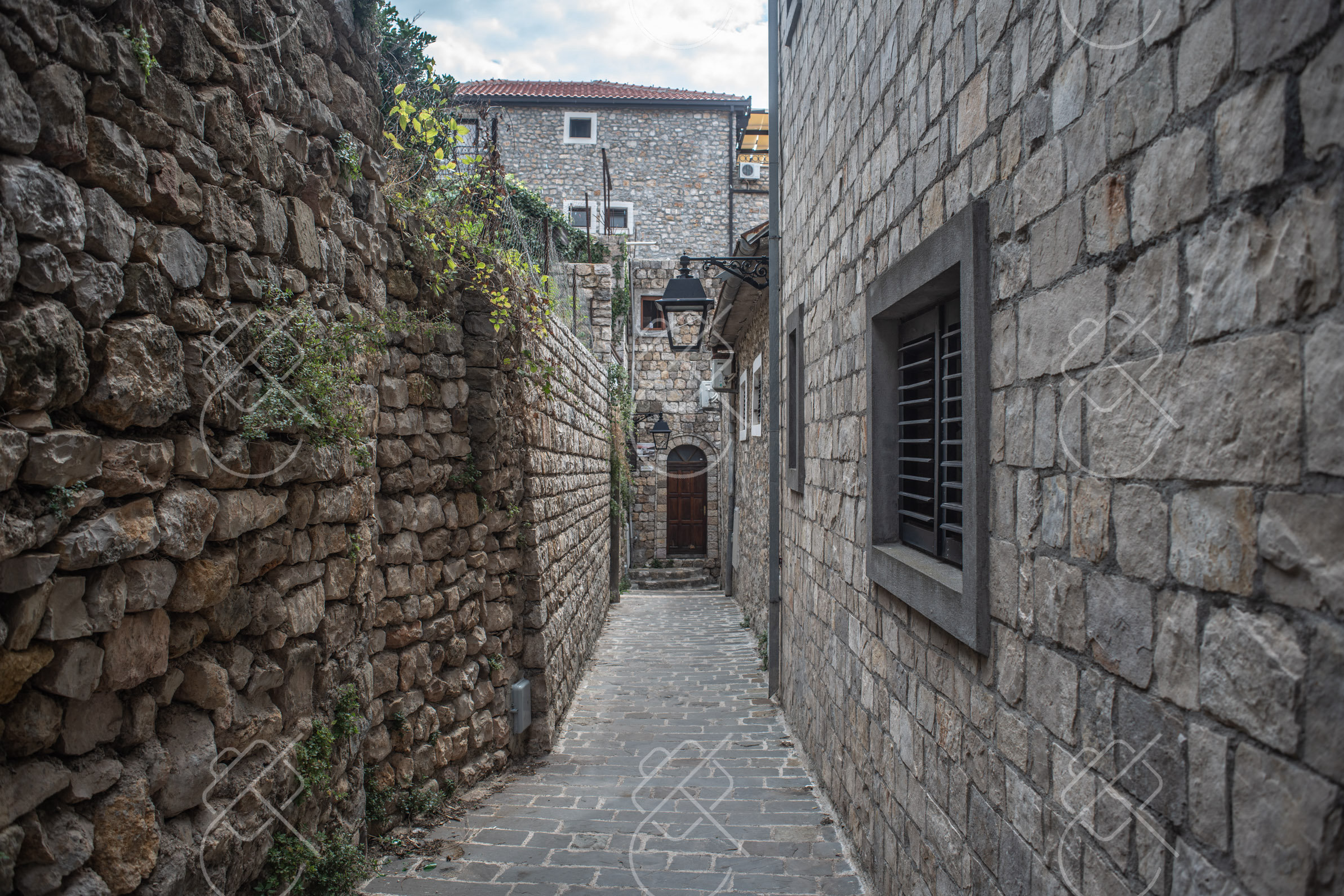 A narrow stone lane inside the Old Town walls — Ulcinj, fine art travel photography print available from Clever Tourists