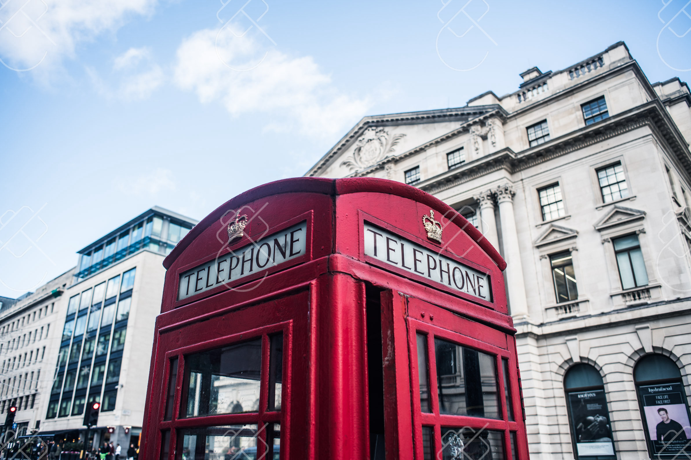 A classic red telephone box beneath London's grand stone facades — London, fine art travel photography print available from Clever Tourists